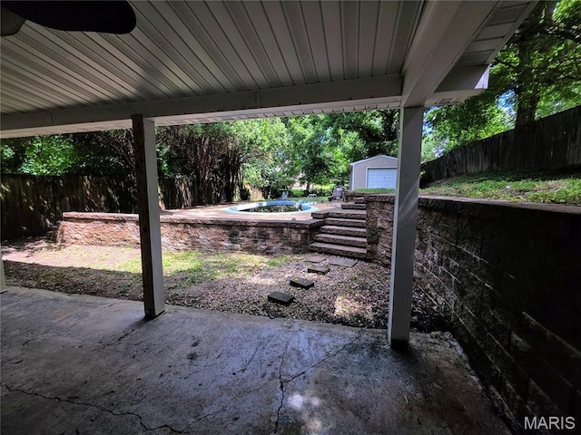 123 W Wickliffe Ave, Collinsville, IL 62234 - fenced backyard with a patio and an outbuilding