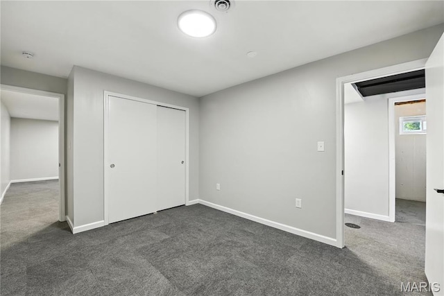 100 Toelle Dr, Saint Charles, MO 63304 - unfurnished bedroom featuring dark carpet and a closet