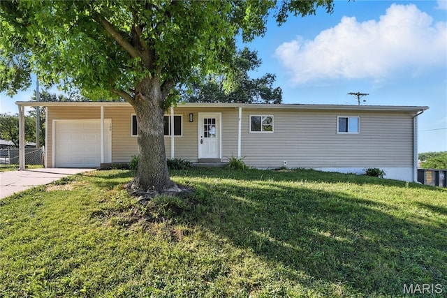 100 Toelle Dr, Saint Charles, MO 63304 - ranch-style house featuring concrete driveway, a garage, and a front lawn