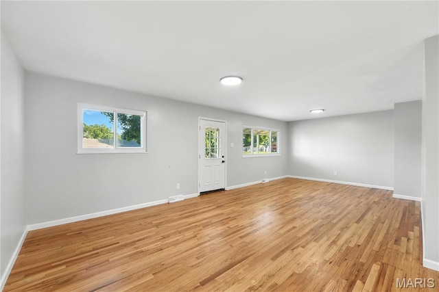 100 Toelle Dr, Saint Charles, MO 63304 - empty room with light wood finished floors and baseboards