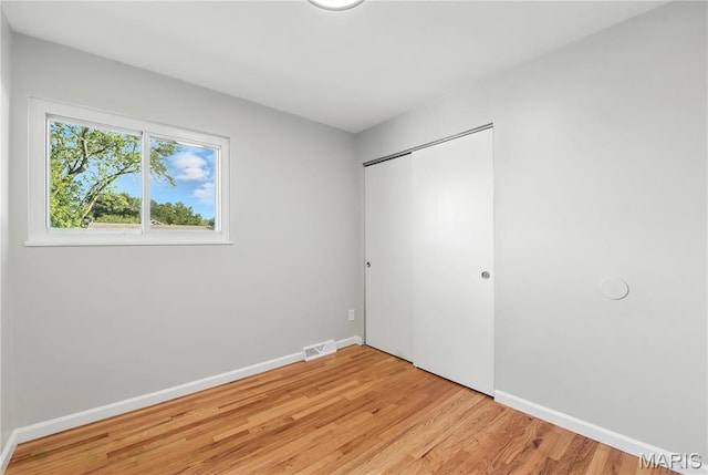 100 Toelle Dr, Saint Charles, MO 63304 - unfurnished bedroom featuring light wood-style floors and a closet