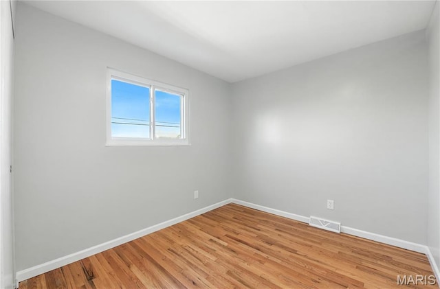 100 Toelle Dr, Saint Charles, MO 63304 - spare room with baseboards and light wood finished floors
