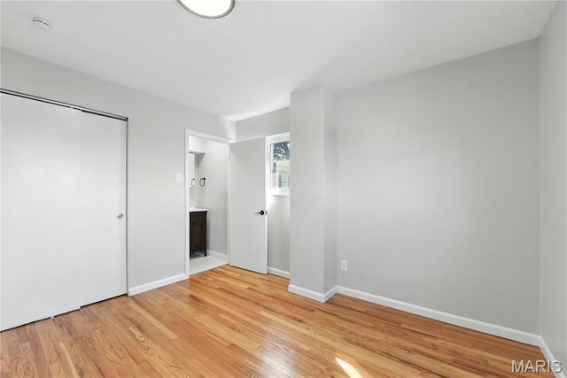 100 Toelle Dr, Saint Charles, MO 63304 - unfurnished bedroom featuring light wood-style floors and ensuite bathroom