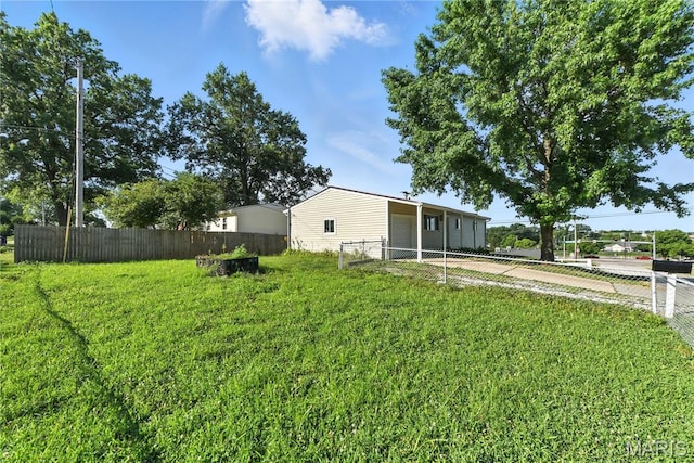 100 Toelle Dr, Saint Charles, MO 63304 - view of yard featuring driveway and a detached garage