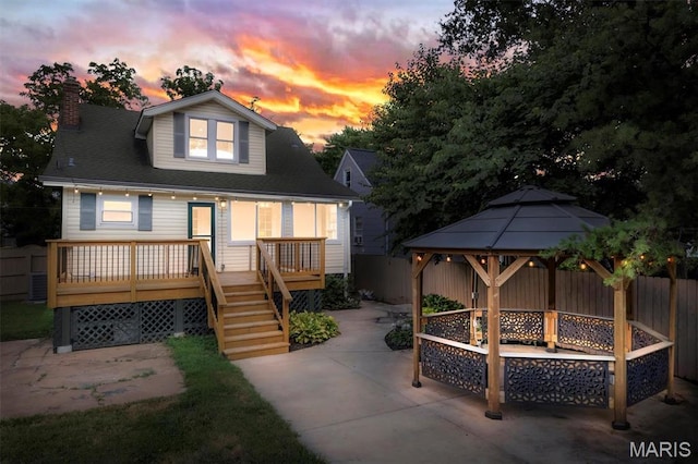 2733 Hermitage Ave, Saint Louis, MO 63143 - back of house featuring a gazebo, a patio, a chimney, a deck, and stairs