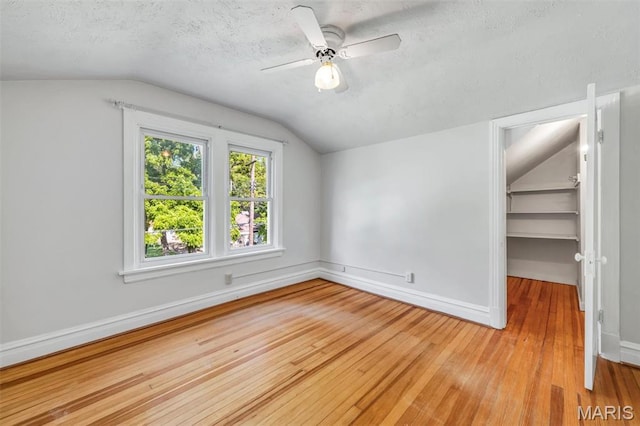 2733 Hermitage Ave, Saint Louis, MO 63143 - bonus room with light wood-type flooring, vaulted ceiling, a textured ceiling, and ceiling fan