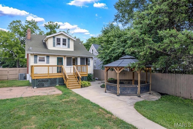 2733 Hermitage Ave, Saint Louis, MO 63143 - back of house featuring a gazebo, a patio area, a fenced backyard, and a chimney