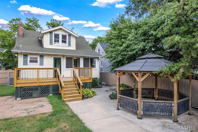 2733 Hermitage Ave, Saint Louis, MO 63143 - bungalow-style home featuring a fenced backyard, a gazebo, a patio area, and a chimney