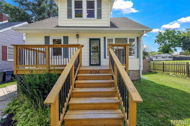 2733 Hermitage Ave, Saint Louis, MO 63143 - view of front of house featuring roof with shingles and a wooden deck