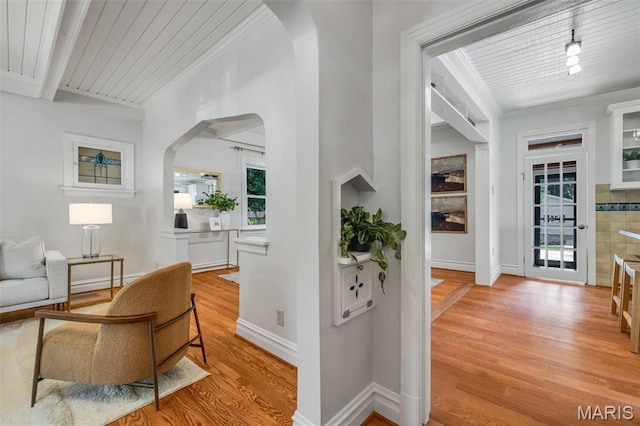 2733 Hermitage Ave, Saint Louis, MO 63143 - foyer with arched walkways, light wood-style flooring, ornamental molding, and wooden ceiling