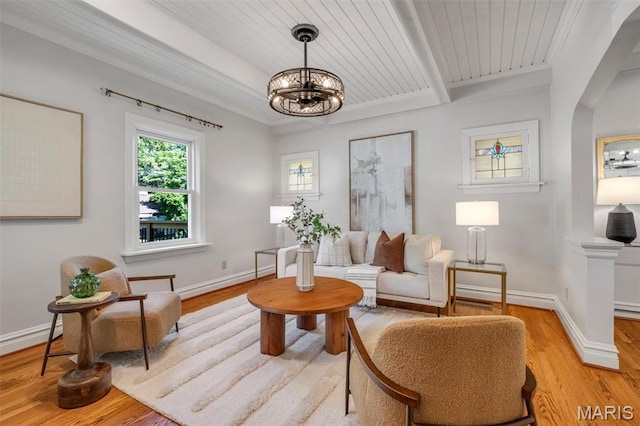 2733 Hermitage Ave, Saint Louis, MO 63143 - living room with light wood-type flooring, a chandelier, and a wooden ceiling with exposed beams
