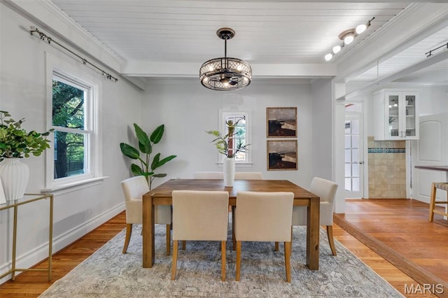 2733 Hermitage Ave, Saint Louis, MO 63143 - dining room featuring light wood-style floors and a chandelier