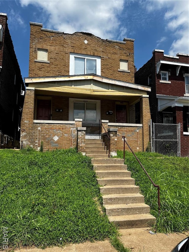 4045 Shreve Ave, Saint Louis, MO 63115 - view of front of home featuring a porch and brick siding