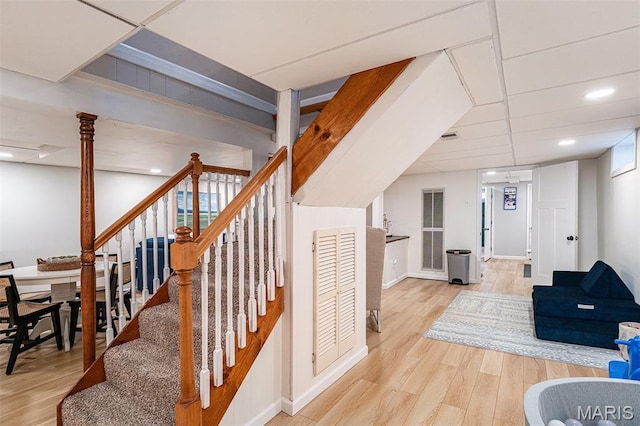 107 Huntleigh Dr, Kirkwood, MO 63122 - stairs featuring wood finished floors and recessed lighting