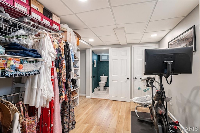 107 Huntleigh Dr, Kirkwood, MO 63122 - walk in closet featuring wood finished floors and a drop ceiling