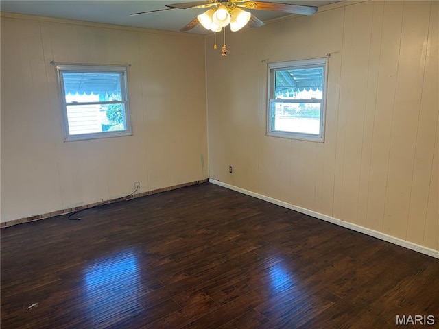 1150 Wabash Ave, Belleville, IL 62220 - unfurnished room with dark wood-style flooring, ceiling fan, and ornamental molding