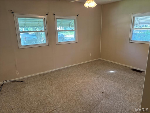 1150 Wabash Ave, Belleville, IL 62220 - carpeted empty room featuring healthy amount of natural light and a ceiling fan