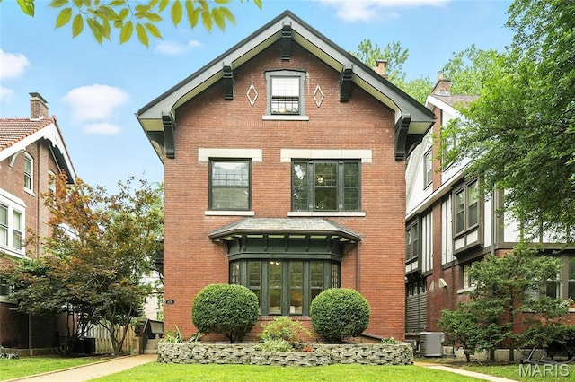 6336 Pershing Ave, University City, MO 63130 - view of front of house featuring brick siding and a front lawn