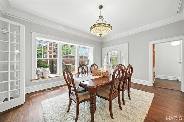 6336 Pershing Ave, University City, MO 63130 - dining room featuring ornamental molding and dark wood-style floors