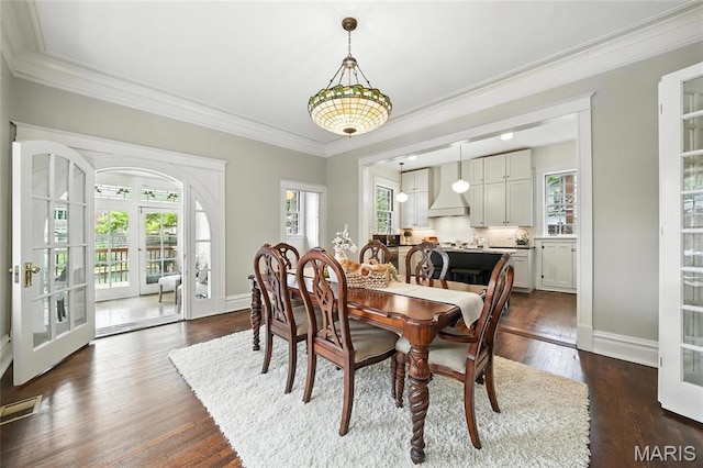 6336 Pershing Ave, University City, MO 63130 - dining room with crown molding, french doors, and dark wood-style floors