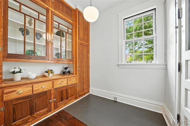 6336 Pershing Ave, University City, MO 63130 - unfurnished dining area featuring baseboards