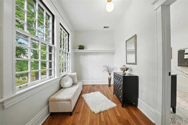 6336 Pershing Ave, University City, MO 63130 - living area featuring baseboards and wood finished floors