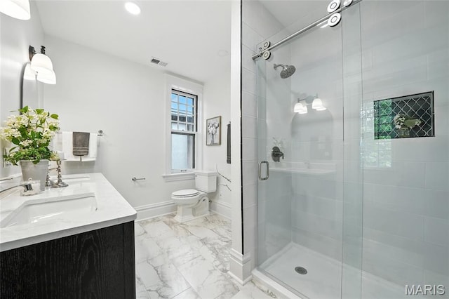 6336 Pershing Ave, University City, MO 63130 - full bath featuring a shower stall, marble look tiles, double vanity, and recessed lighting