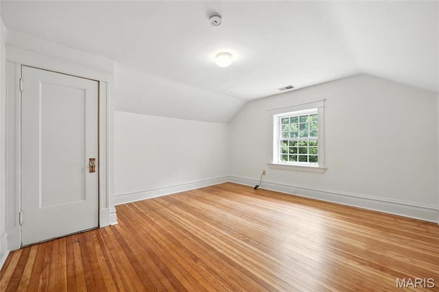 6336 Pershing Ave, University City, MO 63130 - bonus room featuring lofted ceiling and hardwood / wood-style flooring