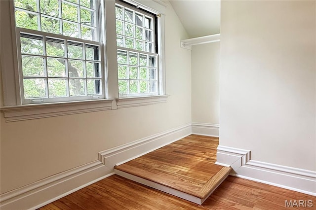 6336 Pershing Ave, University City, MO 63130 - spacious closet featuring vaulted ceiling and wood finished floors