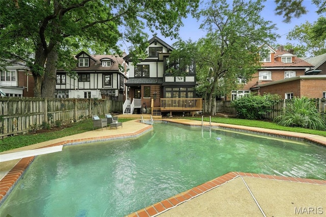 6336 Pershing Ave, University City, MO 63130 - view of pool featuring a deck, a fenced backyard, and a diving board