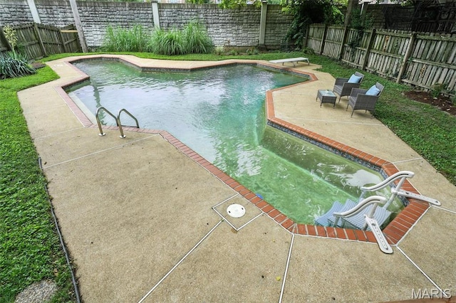 6336 Pershing Ave, University City, MO 63130 - view of swimming pool featuring a fenced backyard, a patio area, and a diving board