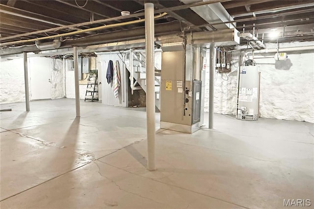 6336 Pershing Ave, University City, MO 63130 - unfinished basement featuring water heater, heating unit, and electric panel