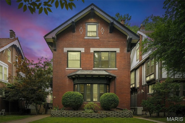 6336 Pershing Ave, University City, MO 63130 - view of front of house with brick siding and a front lawn