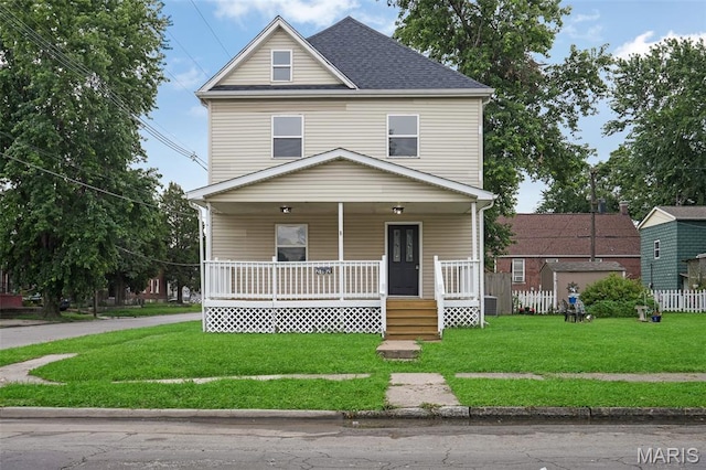 2162 State St, Granite City, IL 62040 - american foursquare style home featuring a porch, a front lawn, and roof with shingles