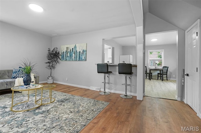 2162 State St, Granite City, IL 62040 - living room featuring wood finished floors and lofted ceiling