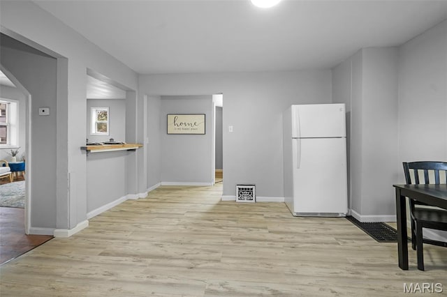 2162 State St, Granite City, IL 62040 - unfurnished dining area featuring arched walkways and light wood-type flooring