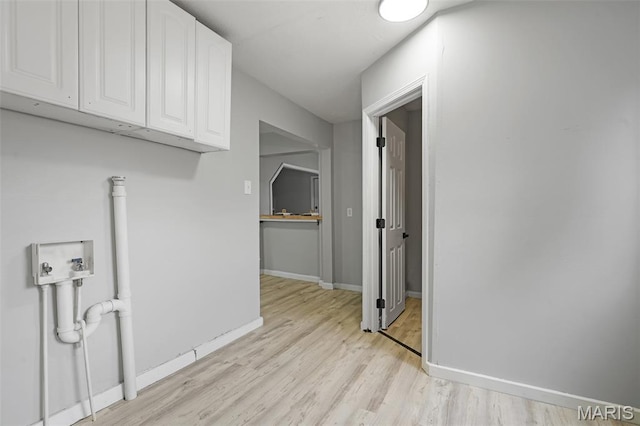 2162 State St, Granite City, IL 62040 - laundry room with light wood-style floors, hookup for a washing machine, and cabinet space