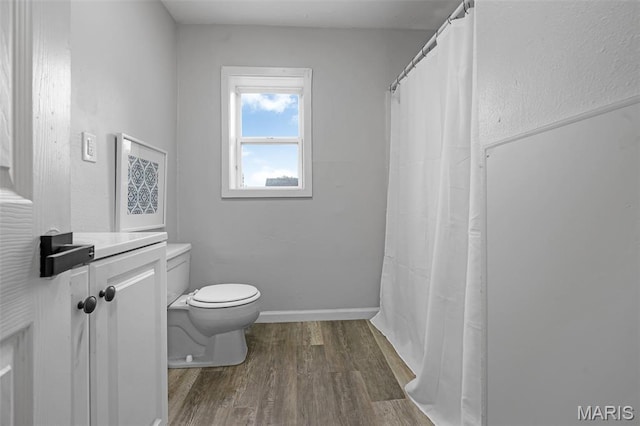 2162 State St, Granite City, IL 62040 - full bathroom with wood finished floors, vanity, and a shower with curtain