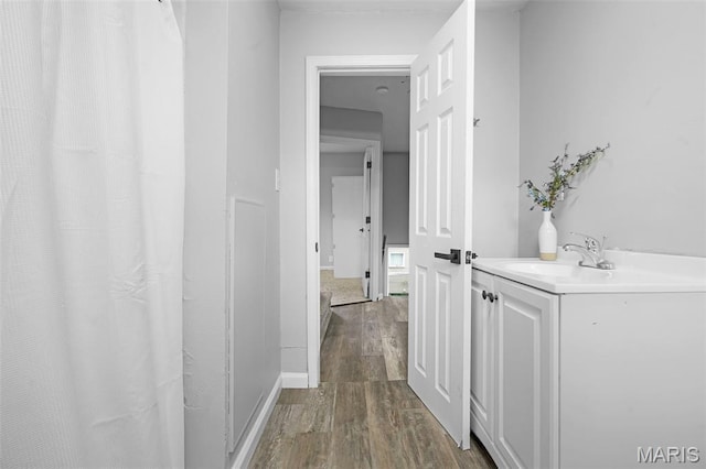 2162 State St, Granite City, IL 62040 - corridor featuring a sink and dark wood-style flooring