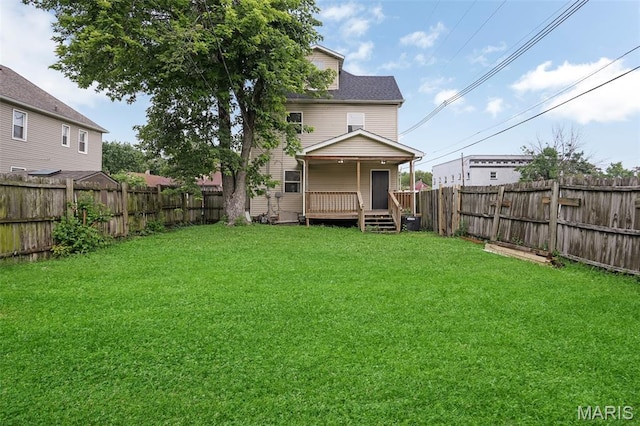 2162 State St, Granite City, IL 62040 - back of house with a fenced backyard and a wooden deck