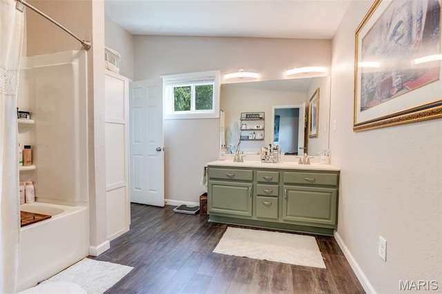 116 N Washington St, Troy, IL 62294 - bathroom featuring wood finished floors, double vanity, and shower / bath combination with curtain