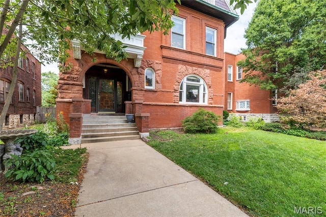 4365 Forest Park Ave, Saint Louis, MO 63108 - property entrance featuring brick siding and a yard