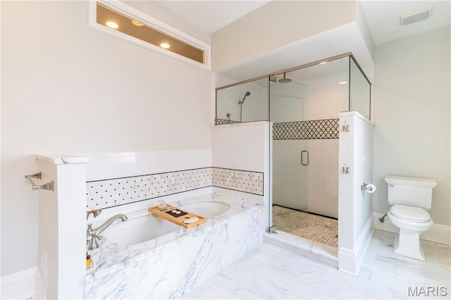4365 Forest Park Ave, Saint Louis, MO 63108 - bathroom featuring a garden tub, a stall shower, recessed lighting, and marble finish floors