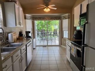 14 Shaderest Ct, Glen Carbon, IL 62034 - kitchen featuring stainless steel appliances, light tile patterned floors, lofted ceiling, ceiling fan, and white cabinetry