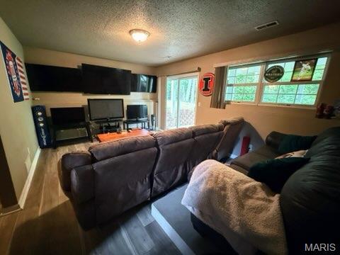 14 Shaderest Ct, Glen Carbon, IL 62034 - living area with a textured ceiling and wood finished floors