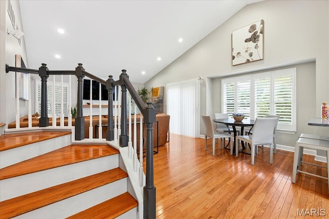 1909 King Arthur Ct, Saint Louis, MO 63146 - stairs with hardwood / wood-style floors, recessed lighting, and high vaulted ceiling