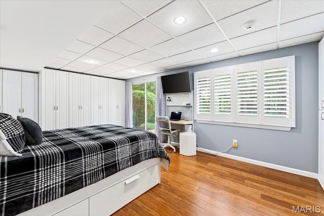 1909 King Arthur Ct, Saint Louis, MO 63146 - bedroom featuring light wood-type flooring, access to outside, recessed lighting, and a drop ceiling
