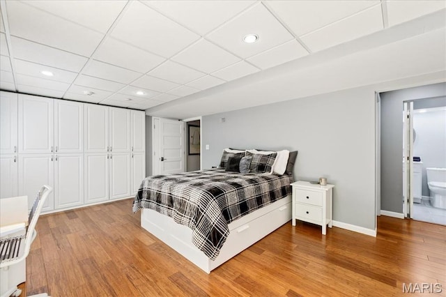 1909 King Arthur Ct, Saint Louis, MO 63146 - bedroom featuring light wood-style flooring, recessed lighting, and a paneled ceiling