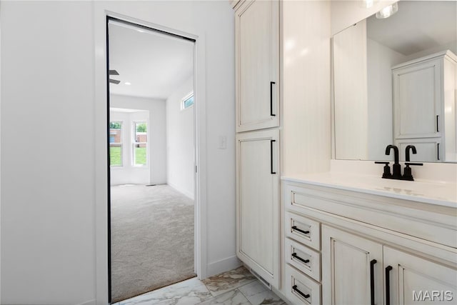 522 Dove Dr, Saint Charles, MO 63301 - bathroom featuring marble look tile flooring and vanity
