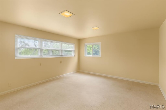 7637 Lynn Ave, University City, MO 63130 - unfurnished room featuring light carpet and baseboards